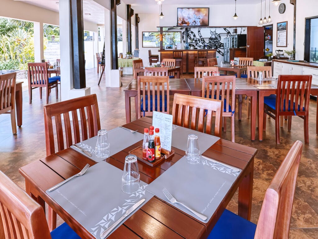 Dining area at Tembaga Restaurant with Lembeh Strait and pool views, Solitude Lembeh Resort