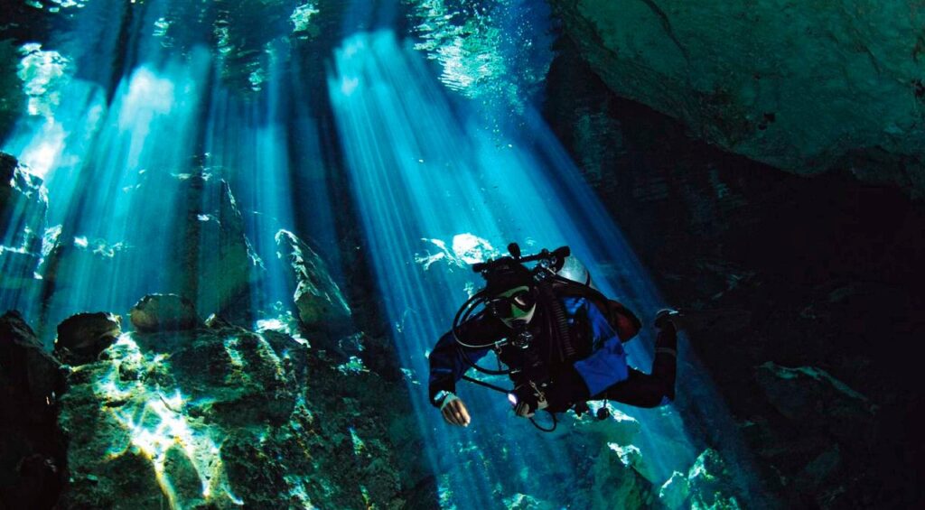 cave diving in sistema sac actun, mexico