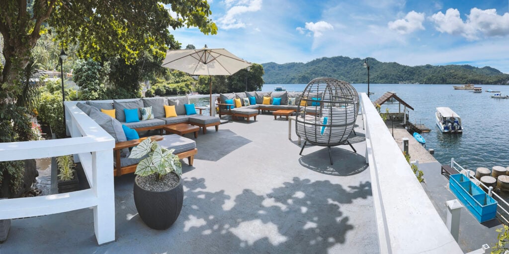 An open rooftop lounge featuring relaxed seating and an extended snack area, designed for guests to gather, unwind and enjoy uninterrupted views of the ocean.